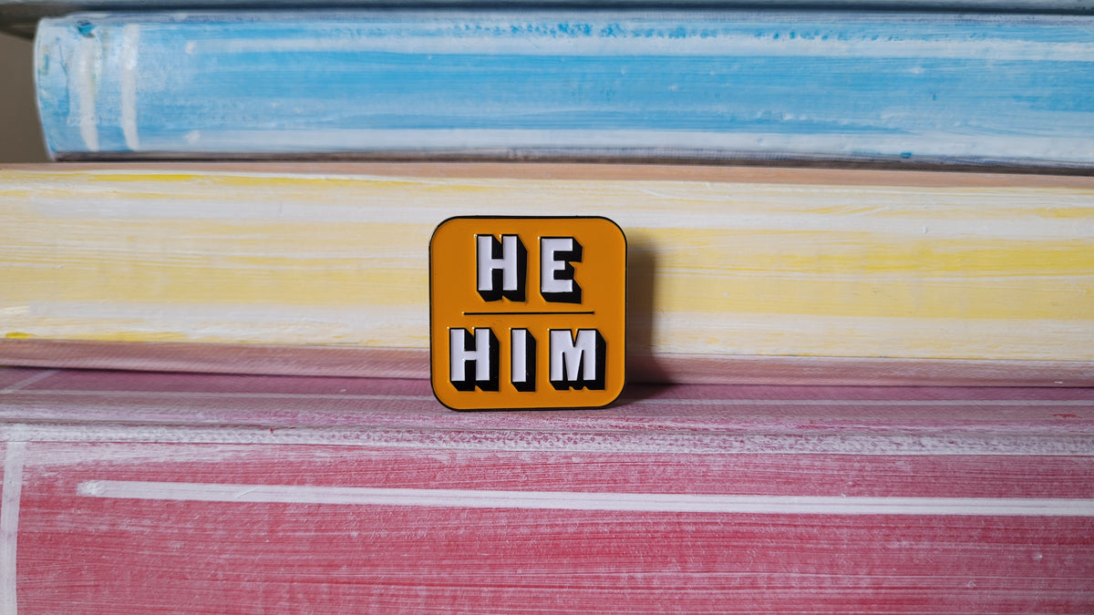 Pin: He/Him Yellow